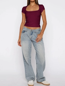 Full view of wine red square neck short sleeve crop top paired with light blue baggy jeans