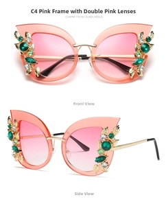 Detail of pink cat-eye sunglasses with green gemstone and golden leaf accents