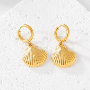 Golden stainless steel hoop earrings with elegant seashell texture pendants on white stone