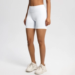 Detail of high-waist white seamless fitness shorts with tummy control waistband and flat seams