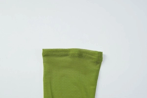 Detail shot of green mesh fabric with premium double stitching and breathable texture