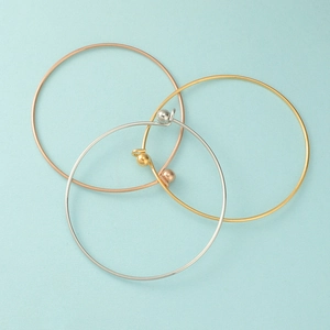 Detailed top view of 1.5mm stainless steel open bangles in gold silver and rose gold finish