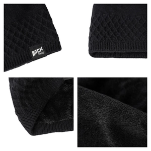 Detail of black knit beanie with plush fleece lining and ROCK trend woven label