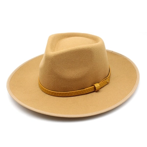 Top view of camel wool felt fedora hat with yellow woven band and wide flat brim