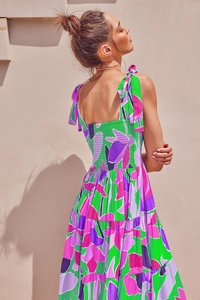Detail of adjustable shoulder straps and elastic smocked back on floral sundress