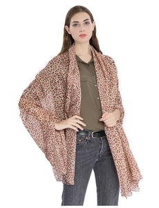 Detail shot of lightweight leopard print scarf with red and brown spots on beige fabric