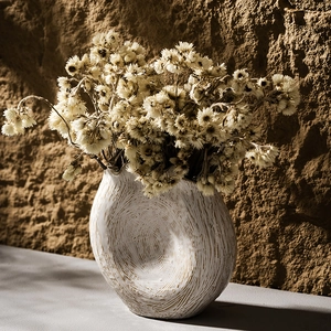 Nordic minimalist white ceramic vase with unique texture and dried flowers for home decor