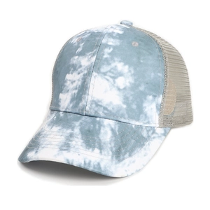 Close-up of tie-dye baseball cap with blue patterns and breathable grey mesh back