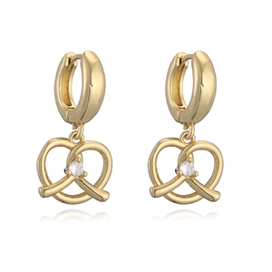 Gold pretzel heart earrings with central white zircon shown in a professional studio view