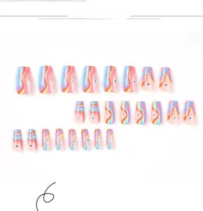 Detail of colorful wave nails with white flowers and small rhinestones on trapezoid tips