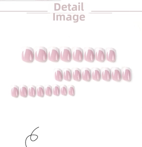 Flat lay showing 24 pieces of pink and white French tip press-on nails in various sizes