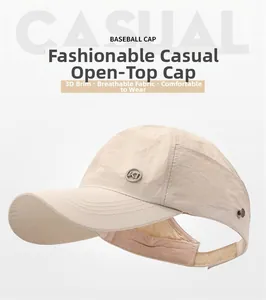 Detail of beige open-top baseball cap featuring breathable textured fabric and metal logo