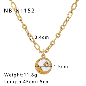 Detailed view of sun and moon pendant with dimensions 1.5cm on 18K gold plated chain