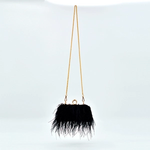 Elegant black ostrich feather evening bag with golden ring clasp and metal chain strap