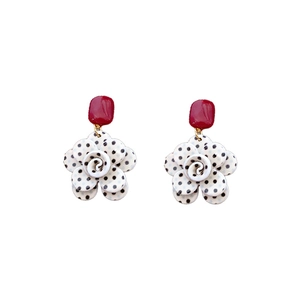 Elegant acrylic flower stud earrings with red rectangular top and black polka dots