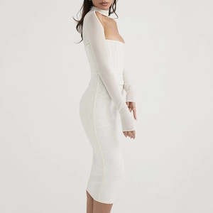 Detailed side view of a white cutout long sleeve midi dress with sheer mesh texture
