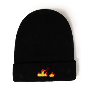 Detailed embroidery of a red flame pattern on a black ribbed knit beanie hat