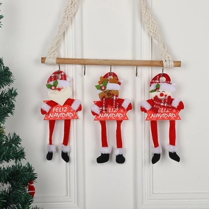Three Christmas hanging plush ornaments including Santa, Reindeer and Snowman on a wooden bar