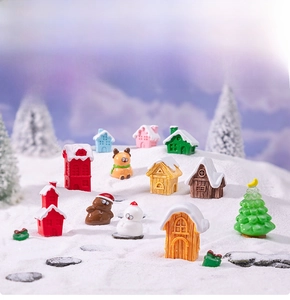 Miniature Christmas resin figurines set featuring snow-capped houses, reindeer and snowman