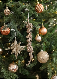 Champagne gold glitter bead fringe with stars and baubles on a Christmas tree