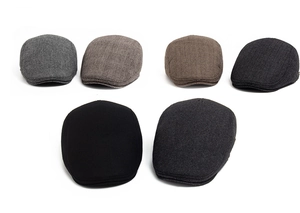 Detail of wool ivy caps in various textures like herringbone, plaid and solid colors