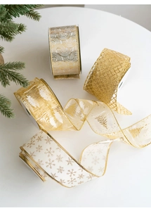 Detail showing assorted gold and white Christmas ribbons with snowflake and grid patterns