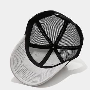 Detailed interior view of mesh trucker hat with gray fabric and breathable black mesh