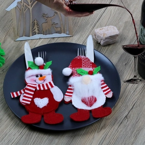 Christmas cutlery holders featuring Santa and Snowman designs for holiday table decor
