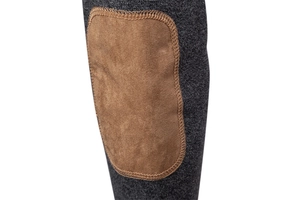 Close-up of dark grey knit sweater sleeve with a brown suede elbow patch detail