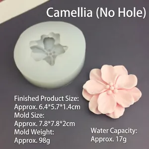 Detail showing silicone camellia flower mold with finished 3D resin flower texture