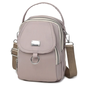 Versatile pink nylon crossbody bag with adjustable strap and multiple zipper pockets