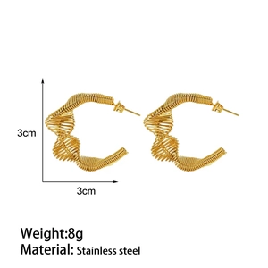 Detail view of 18k gold plated stainless steel spring earrings with 3cm size measurements
