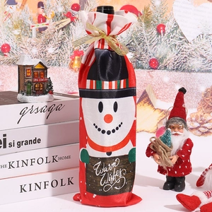 Close-up of snowman wine bottle cover with Warm Wishes sign for Christmas table decor