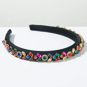 Detail of colorful rhinestones on a black sponge headband with luxury crystal inlay