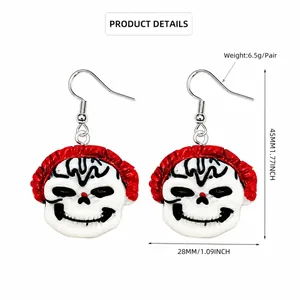 Detail view of ghost face earrings showing 45mm x 28mm size and silver-plated copper hook