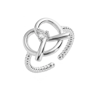 Detailed macro view of the silver twist ring band featuring a centered round zircon stone