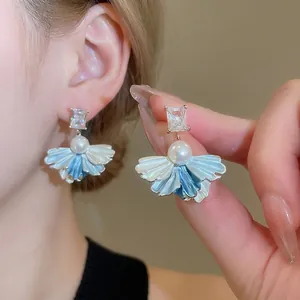 Elegant gold-plated stud earrings with zircon, pearl, and blue-white gradient petals