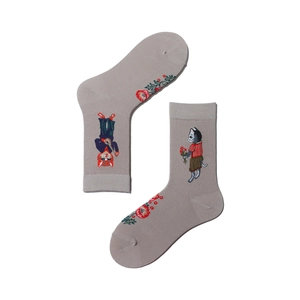 Close-up of cat and floral embroidery on grey cotton blend socks in detail