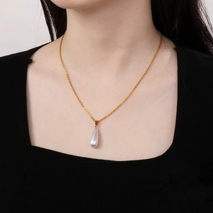Elegant gold titanium steel necklace featuring a teardrop white pearl pendant for women