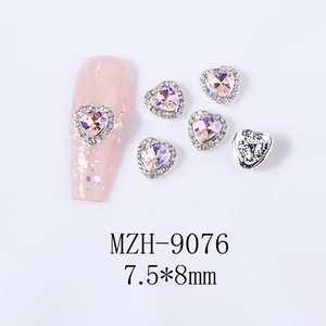 Detail of 7.5x8mm heart-shaped nail charm with silver border and lavender crystal