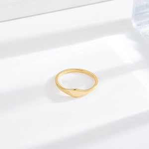 Minimalist gold titanium steel ring featuring an irregular polished shield-shaped design
