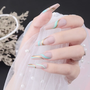 Long coffin press-on nails with matte pink, mint green waves and gold line patterns