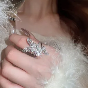 Sparkling silver butterfly ring with micro-paved crystals on an open adjustable band