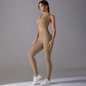 Detail of khaki two-piece yoga set showing matte fabric texture and supportive fit