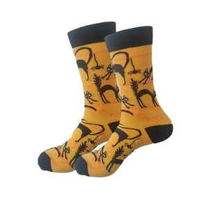 Detail of orange Halloween crew socks with BOO text and black spider web patterns