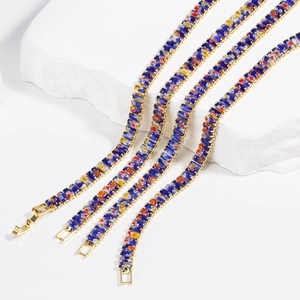 Golden bracelet with colorful square millefiori glass inlays on white stones