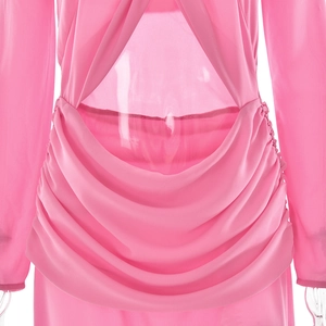 Detail of pink chiffon dress featuring back cutout and elegant draped pleats structure