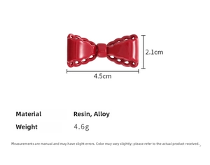 Detail showing red bow hair clip dimensions 4.5cm and polished resin material