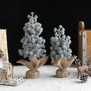 Set of two mini flocked Christmas trees with pine cones and burlap base for tabletop decor