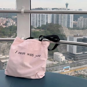 Pink canvas tote bag with black straps and letter print for women casual shoulder use